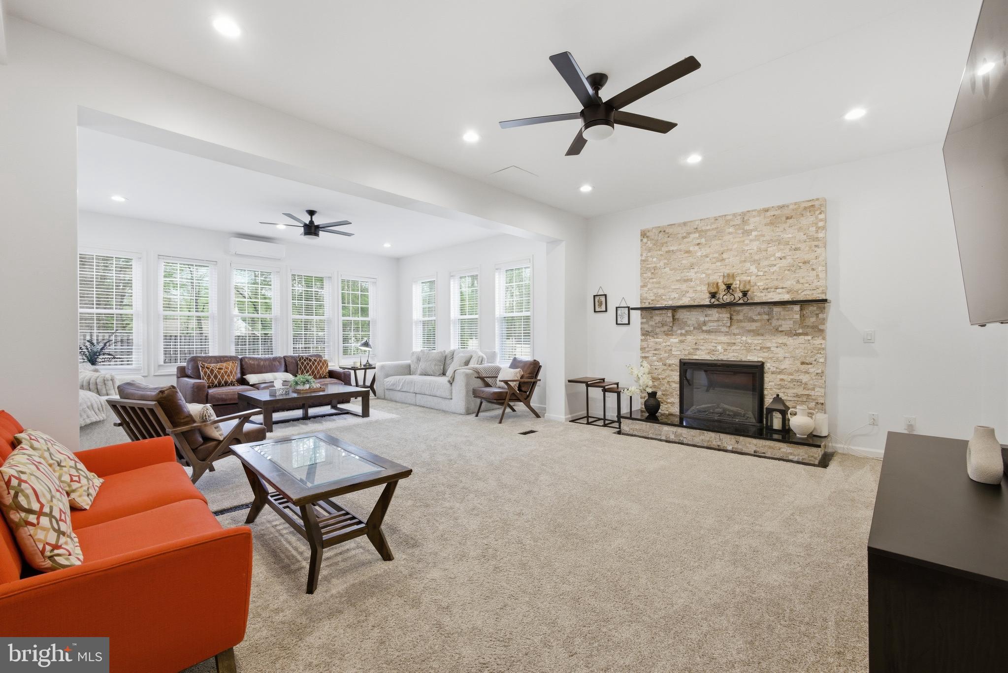 8664 Pohick Forest Court Springfield, VA 22153 - Photo 15 of 41 a living room with furniture a fireplace and a large window