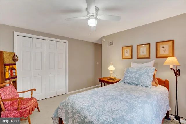 a bedroom with a bed and dresser