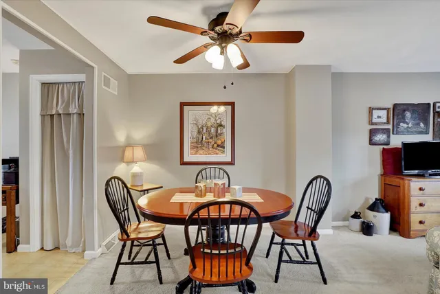 a dining room with furniture and window