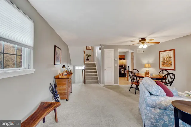 a view of a livingroom with furniture and gym equipment