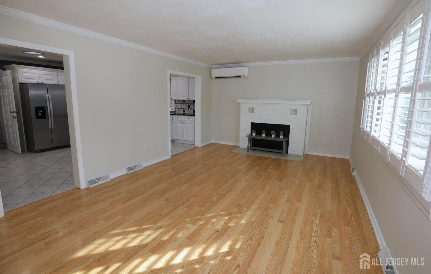 121 Washington Road Princeton, NJ 08540 - Photo 14 of 43 a bedroom with a bed and a fireplace
