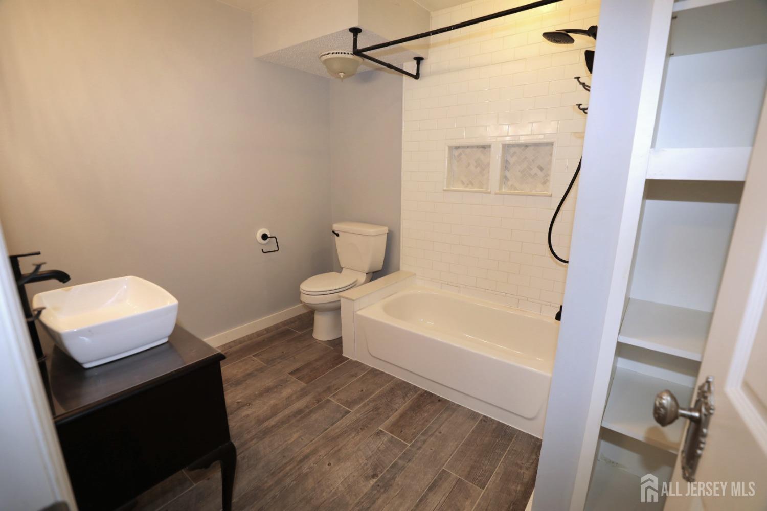 121 Washington Road Princeton, NJ 08540 - Photo 22 of 43 a bathroom with a sink a toilet and shower