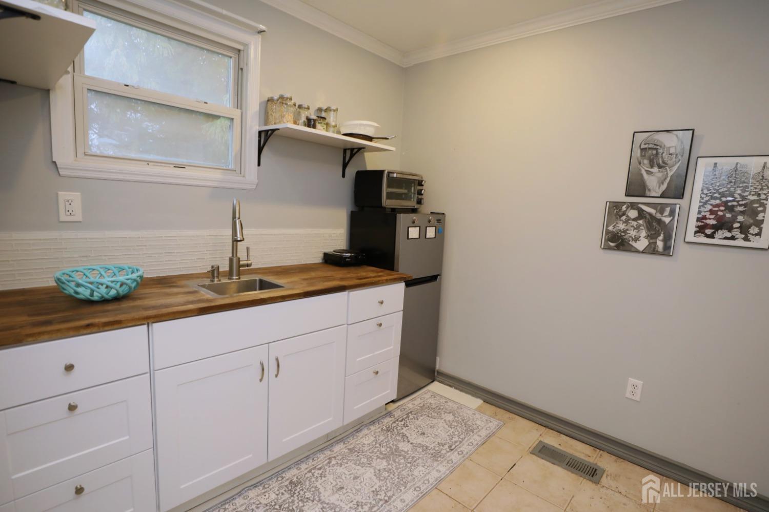 121 Washington Road Princeton, NJ 08540 - Photo 25 of 43 a bathroom with a granite countertop sink and a mirror