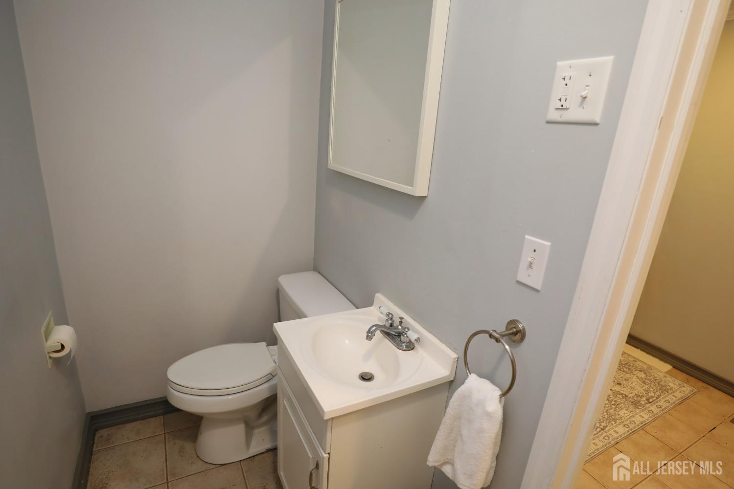 121 Washington Road Princeton, NJ 08540 - Photo 26 of 43 a white toilet sitting next to a bathroom sink