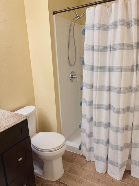 43376 Cook Street, Unit 87 Palm Desert, CA 92211 - Photo 24 of 35 a white toilet sitting next to a shower curtain