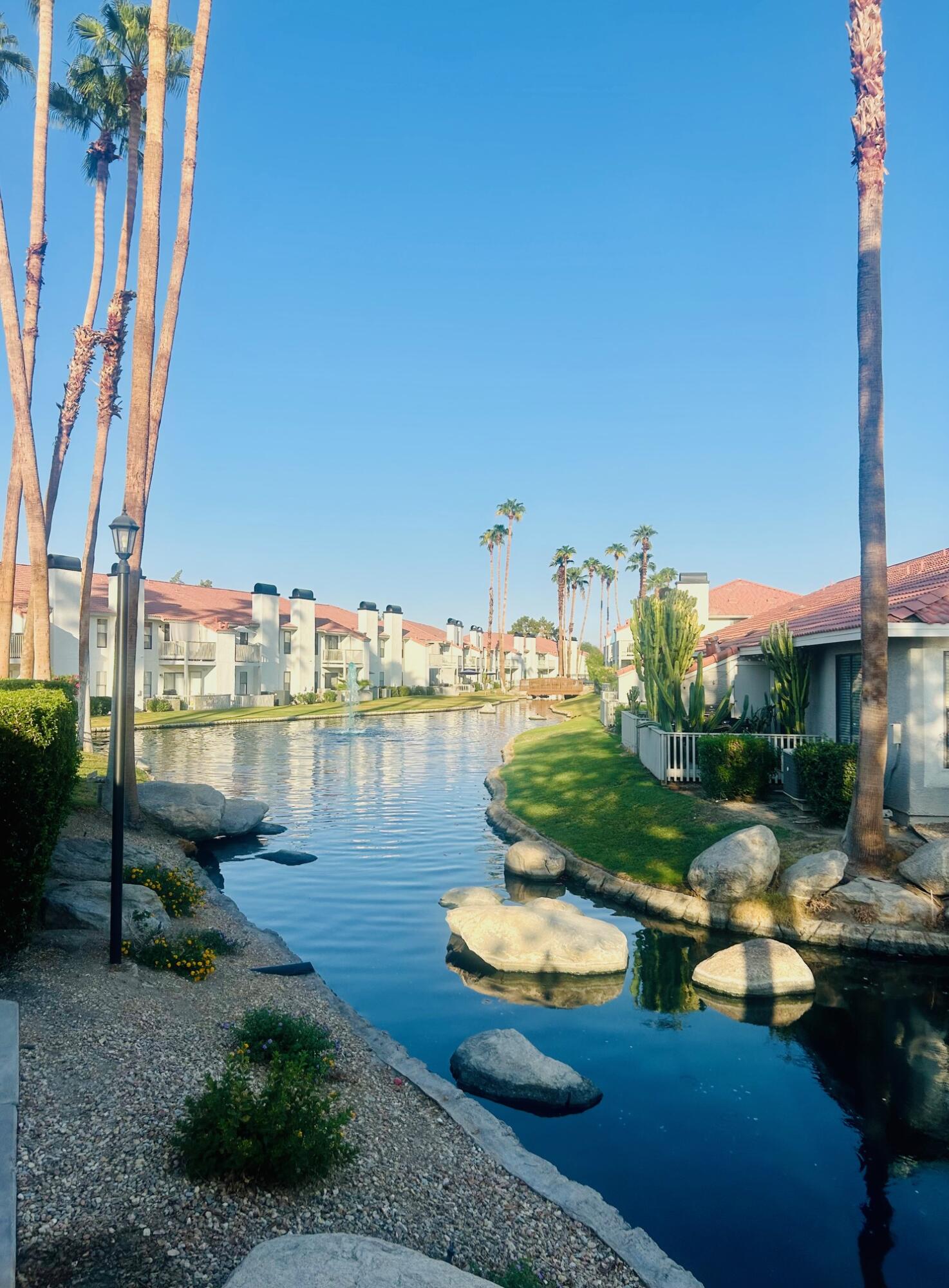 43376 Cook Street, Unit 87 Palm Desert, CA 92211 - Photo 31 of 35 a view of a lake with houses