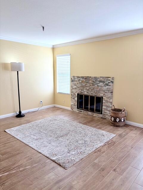 43376 Cook Street, Unit 87 Palm Desert, CA 92211 - Photo 9 of 35 an empty room with a fireplace and wooden floor