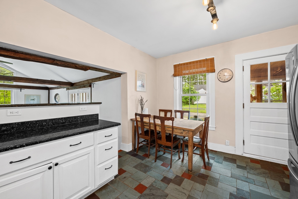 10 Maple Street Sturbridge, MA 01566 - Photo 15 of 40 a kitchen with a table and chairs in it