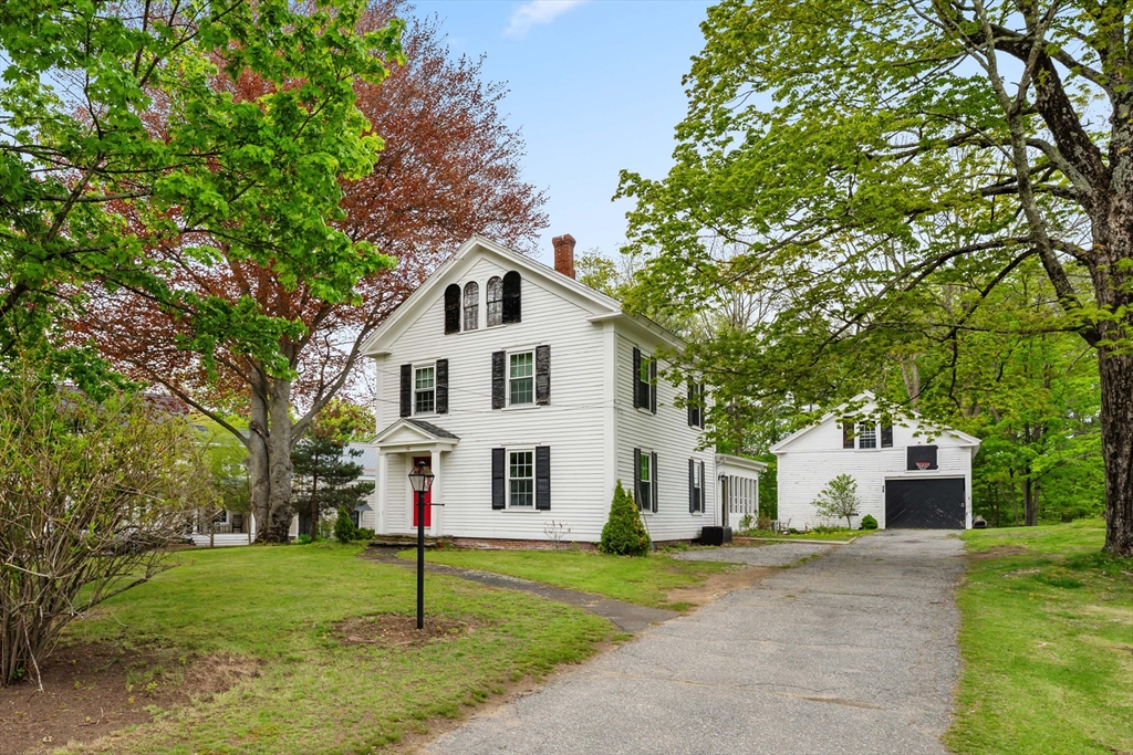 10 Maple Street Sturbridge, MA 01566 - Photo 2 of 40 a view of white house with a yard and large tree