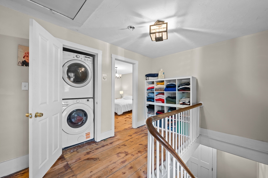 10 Maple Street Sturbridge, MA 01566 - Photo 22 of 40 a view of a hallway with washer and dryer