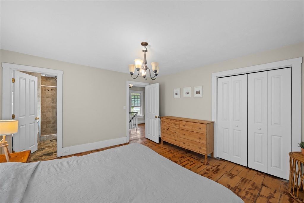 10 Maple Street Sturbridge, MA 01566 - Photo 24 of 40 a bedroom with a bed and a dresser