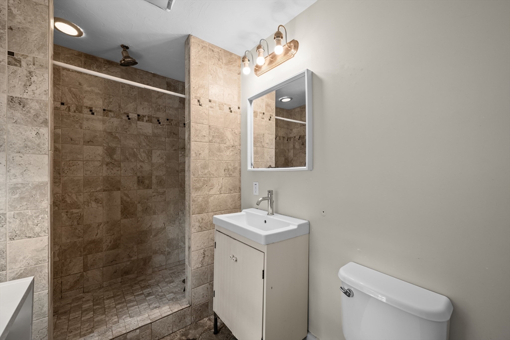 10 Maple Street Sturbridge, MA 01566 - Photo 25 of 40 a bathroom with a sink a toilet and shower