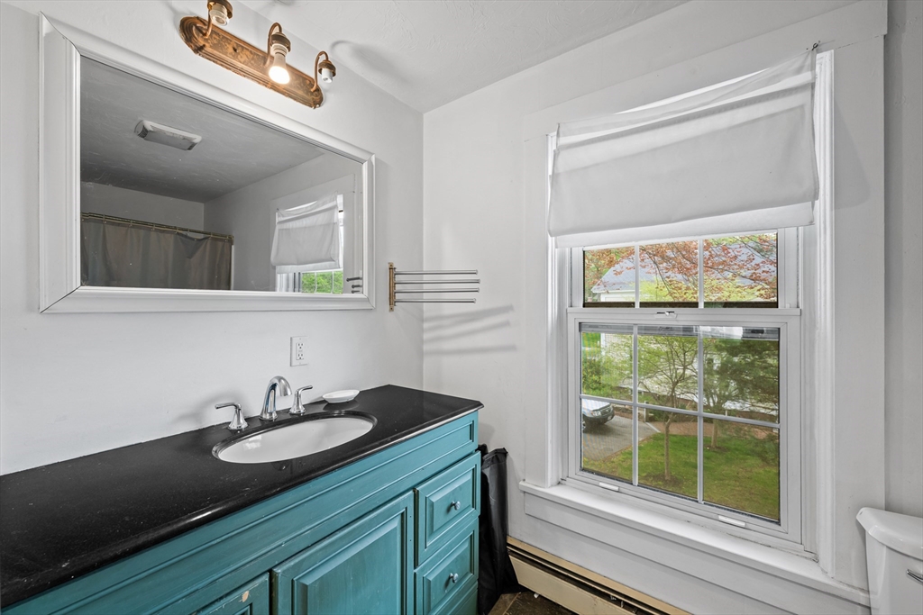 10 Maple Street Sturbridge, MA 01566 - Photo 26 of 40 a bathroom with a sink and a mirror