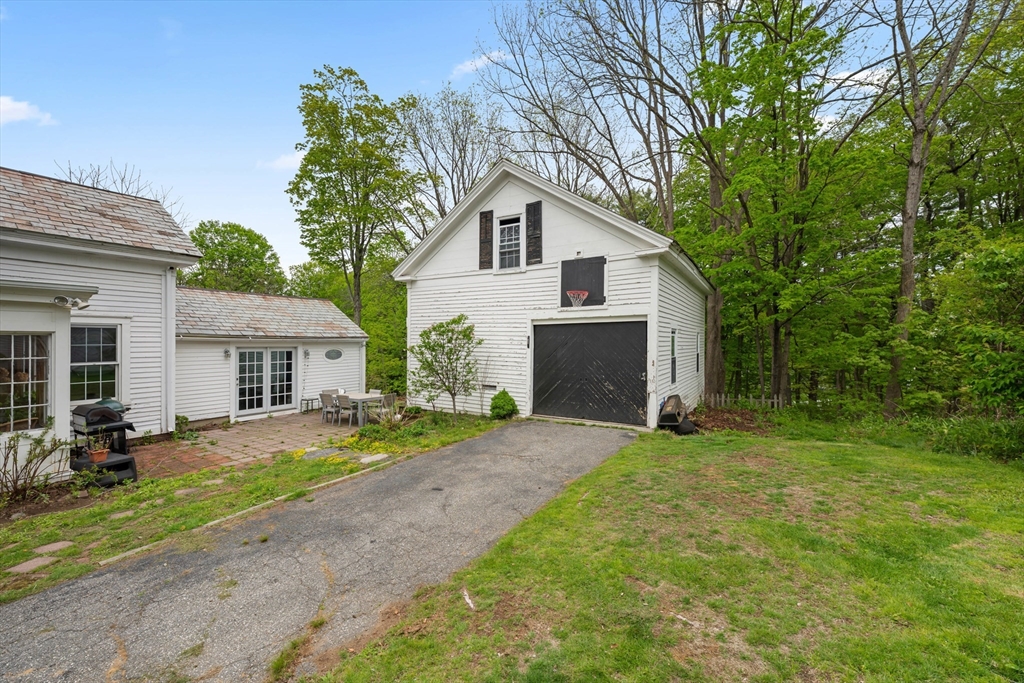 10 Maple Street Sturbridge, MA 01566 - Photo 36 of 40 a view of a house with a yard and large tree