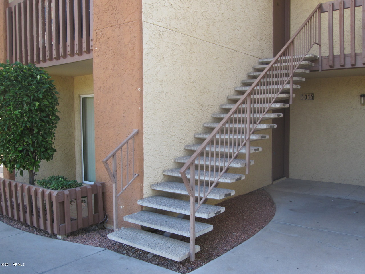 2121 West Royal Palm Road, Unit 1016 Phoenix, AZ 85021 - Photo 1 of 10 a view of entryway with wooden floor and stairs