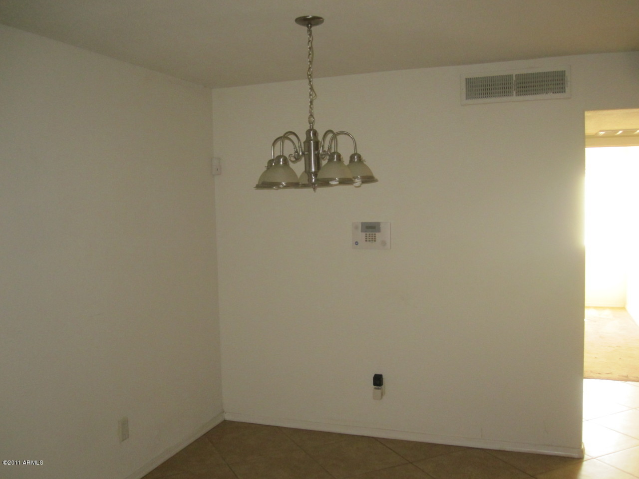 2121 West Royal Palm Road, Unit 1016 Phoenix, AZ 85021 - Photo 6 of 10 a view of a room with a window and kitchen view