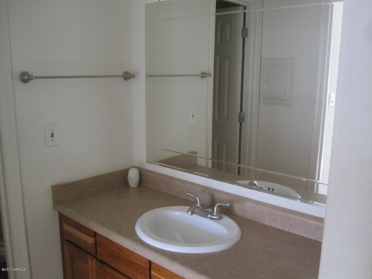 2121 West Royal Palm Road, Unit 1016 Phoenix, AZ 85021 - Photo 7 of 10 a bathroom with a sink and a mirror