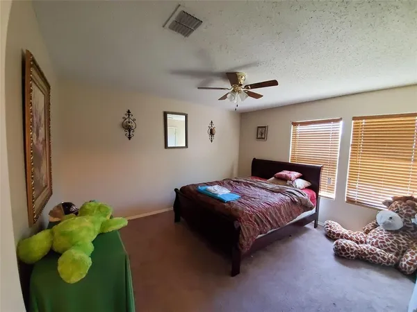 a bedroom with a bed bed and a window