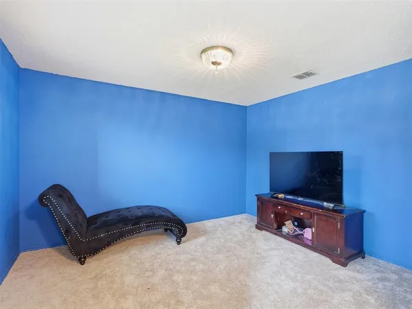 a room with furniture and a flat screen tv