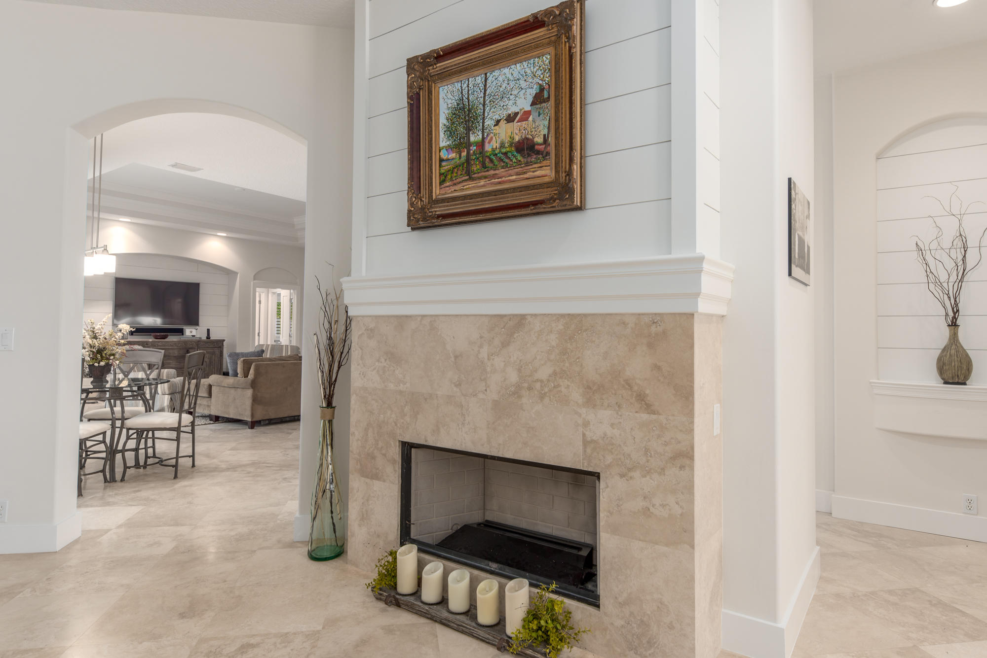 148 Beacon Lane Jupiter Inlet Colony, FL 33469 - Photo 11 of 30 a living room with furniture a fireplace and a table