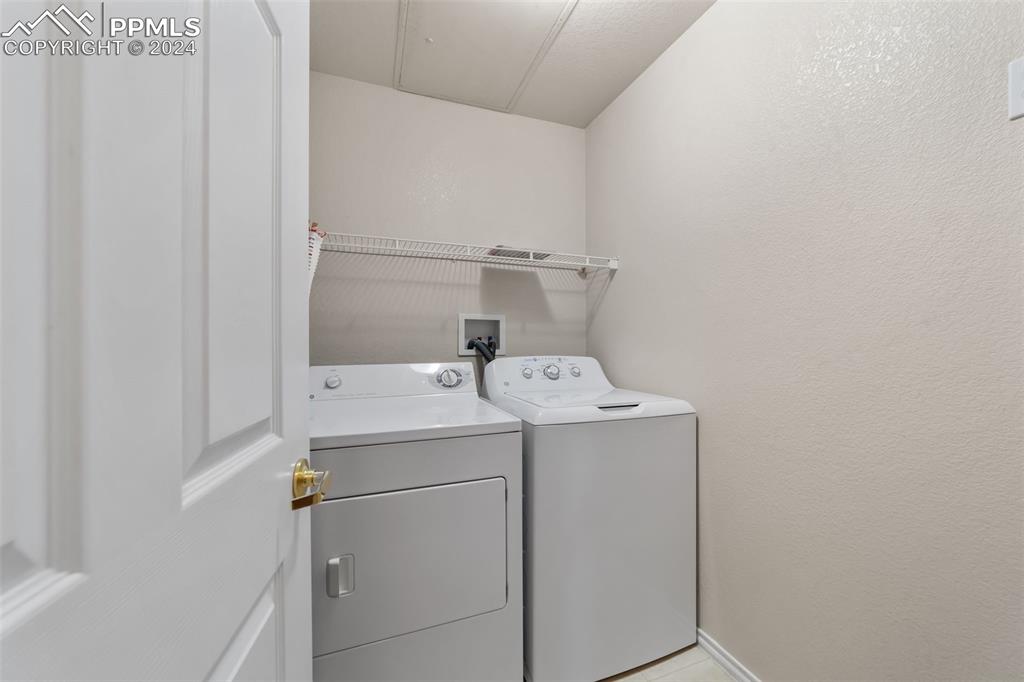 3715 Riviera Grove, Unit 201 Colorado Springs, CO 80922 - Photo 18 of 32 a utility room with dryer and washer
