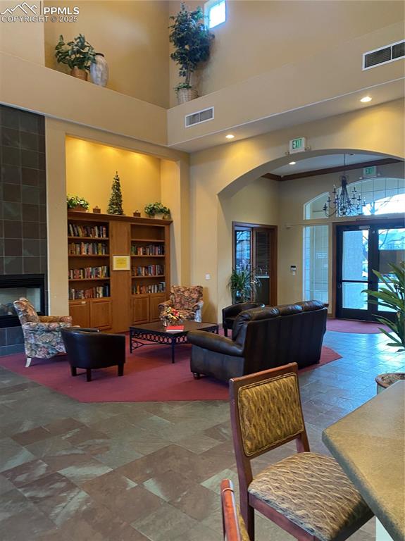 3715 Riviera Grove, Unit 201 Colorado Springs, CO 80922 - Photo 24 of 32 a living room with furniture and a large window