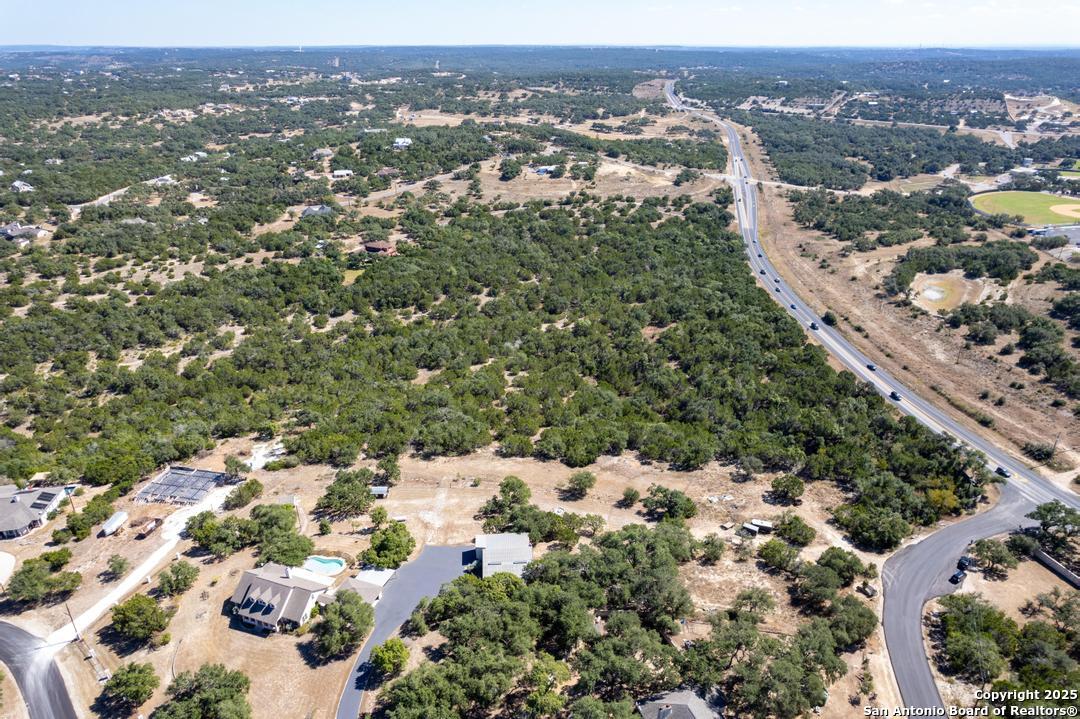 0 State Hwy 46 W Spring Branch, TX 78070 - Photo 26 of 27 an aerial view of a house with a yard