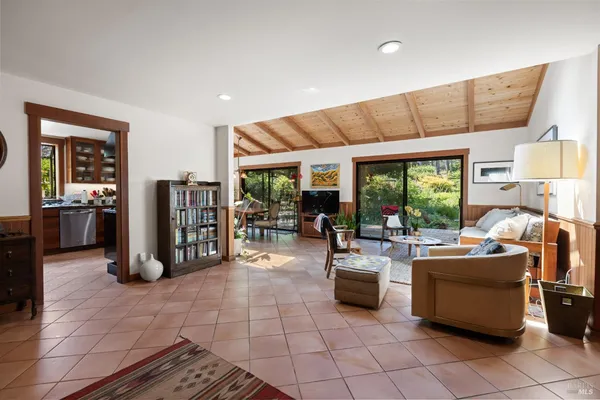 a stove top oven sitting inside of a kitchen