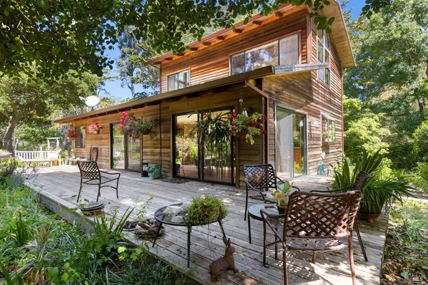 a big yard with lots of green space and deers