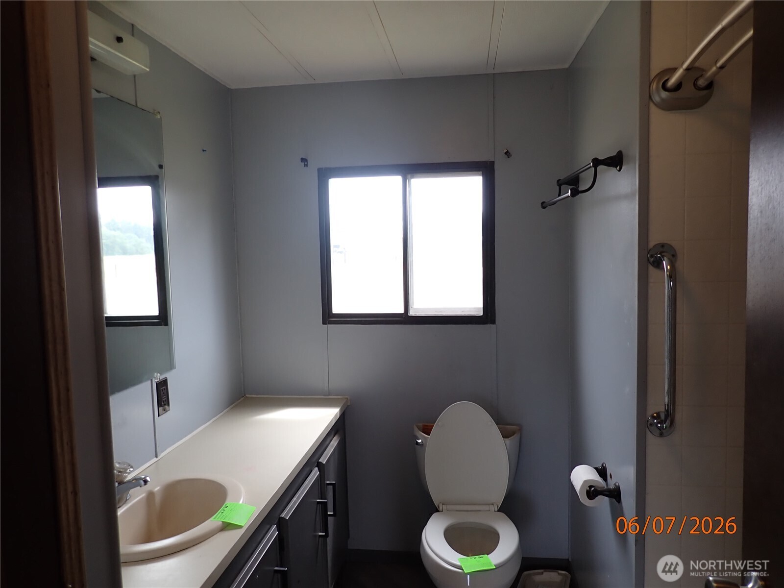 9217 183rd Avenue Southwest Rochester, WA 98579 - Photo 17 of 26 a bathroom with a toilet a sink and a window
