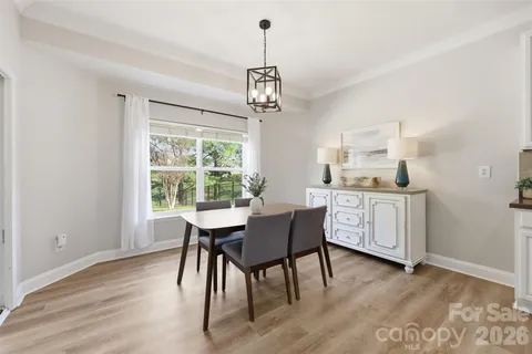 a dining room with furniture window wooden floor