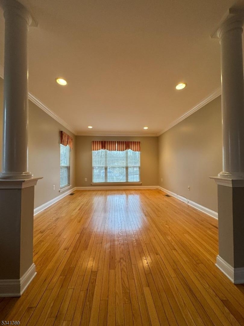10 Hopkinson Court Bernards, NJ 07920 - Photo 4 of 17 a view of empty room with wooden floor and fan
