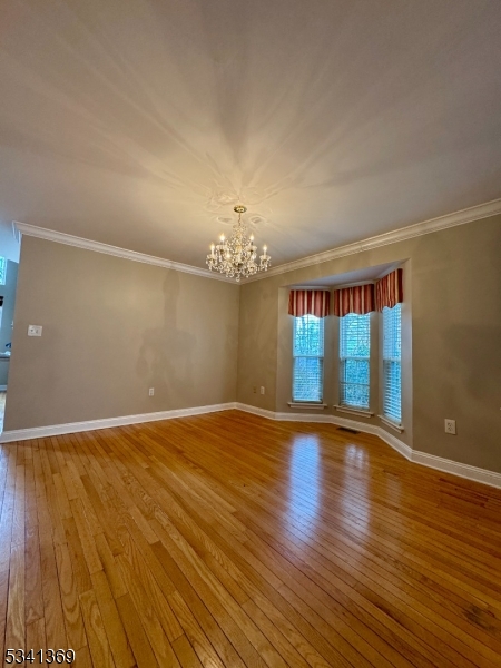 10 Hopkinson Court Bernards, NJ 07920 - Photo 5 of 17 a view of an empty room with wooden floor and a window