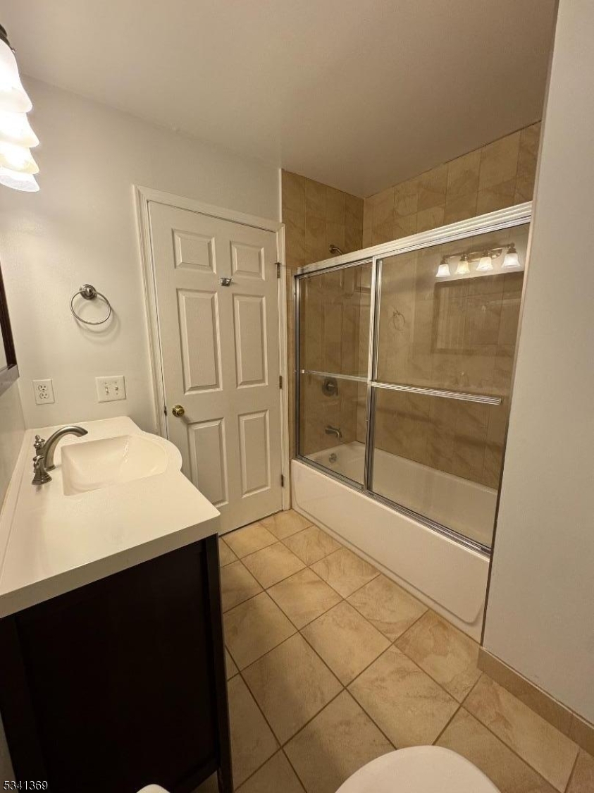 10 Hopkinson Court Bernards, NJ 07920 - Photo 9 of 17 a bathroom with a sink mirror and shower