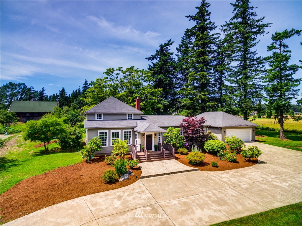 5413 Barr Road Ferndale, WA 98248 - Photo 1 of 40 a view of a house with backyard and garden