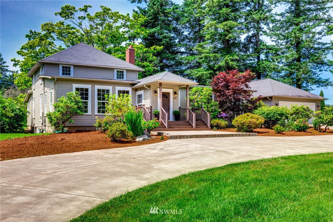5413 Barr Road Ferndale, WA 98248 - Photo 2 of 40 a front view of a house with a yard and garage