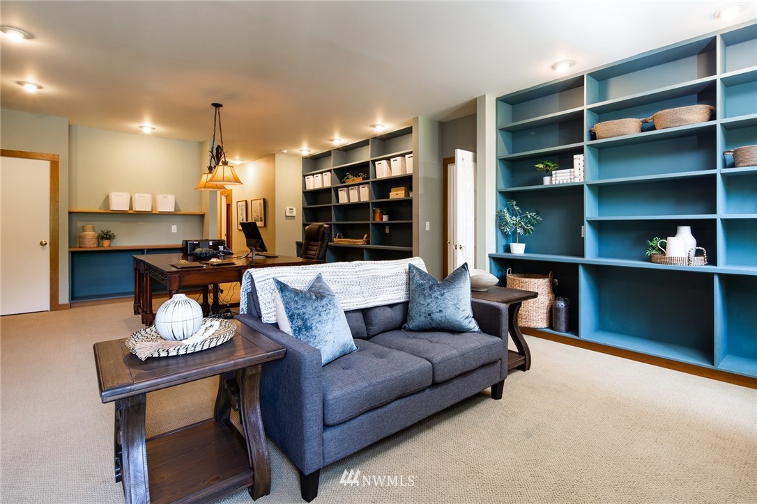 5413 Barr Road Ferndale, WA 98248 - Photo 11 of 40 a living room with furniture and a bookshelf