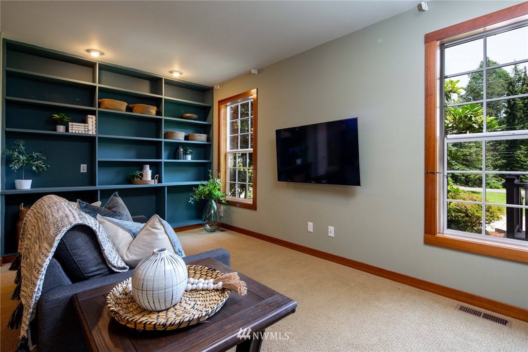 5413 Barr Road Ferndale, WA 98248 - Photo 12 of 40 a living room with furniture and a flat screen tv