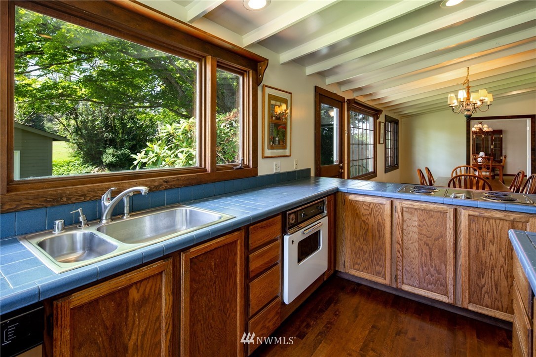5413 Barr Road Ferndale, WA 98248 - Photo 15 of 40 a kitchen with stainless steel appliances granite countertop a sink and a large window