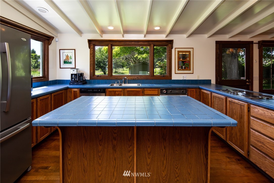 5413 Barr Road Ferndale, WA 98248 - Photo 16 of 40 a dining room with wooden floor and large window