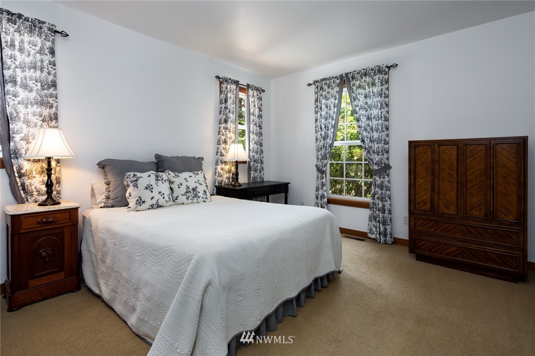 5413 Barr Road Ferndale, WA 98248 - Photo 21 of 40 a bedroom with a bed and a window