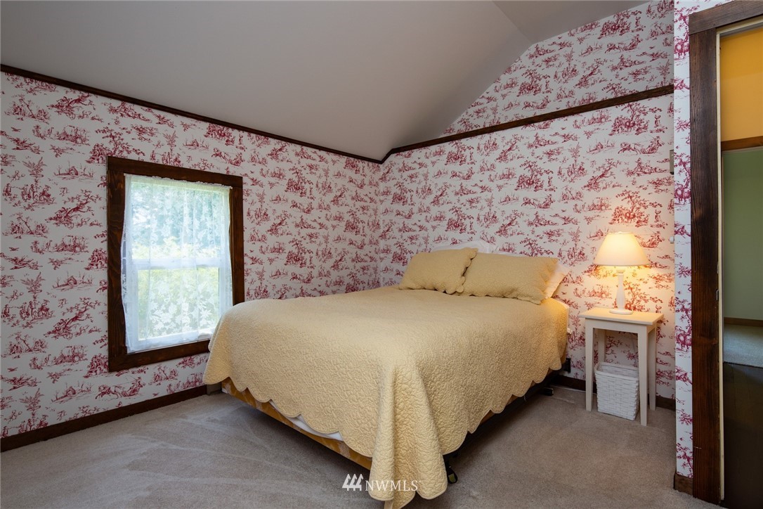 5413 Barr Road Ferndale, WA 98248 - Photo 28 of 40 a bed sitting in a room next to a window