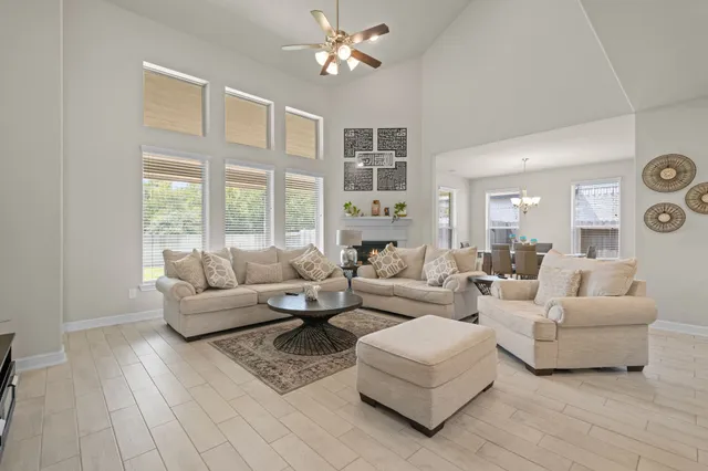 a living room with furniture and a large window