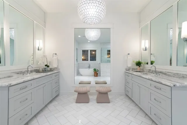 a bathroom with a double vanity sink and a mirror