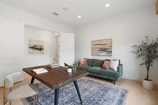 an empty room with a empty space and windows