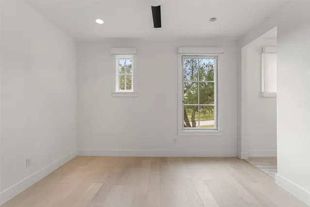 a bathroom with a bathtub shower and a sink