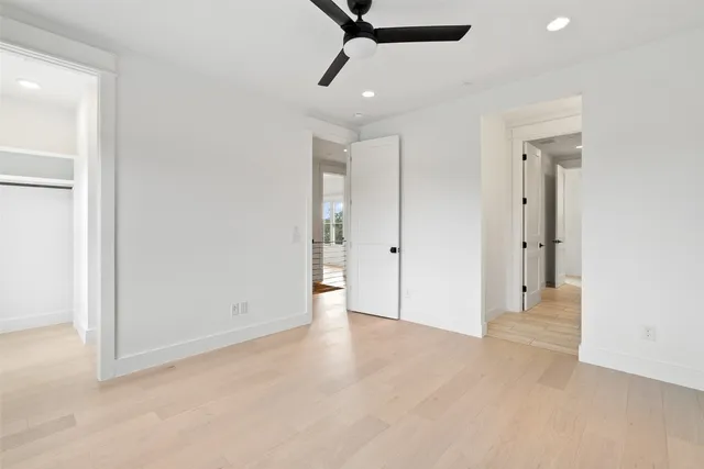 a large white kitchen with a window