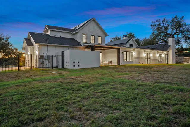 an aerial view of residential houses with ocean view