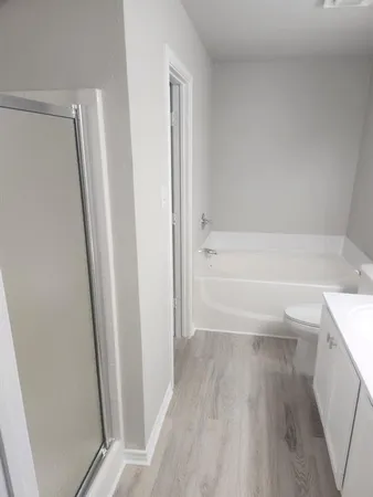 a view of bathroom and a bathtub