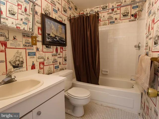 a view of an empty room with closet area